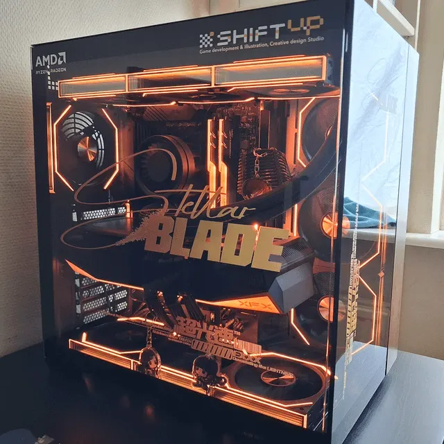 Stellar Blade themed PC case with orange interior lighting