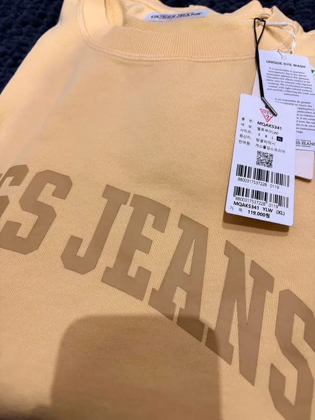 Cream Guess Jeans sweater with the Korean retail tags still attached